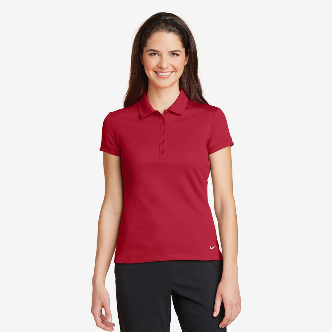 Woman wearing Nike Ladies Dri-FIT Solid Icon Pique Modern Fit Polo in Gym Red Front - 746100
