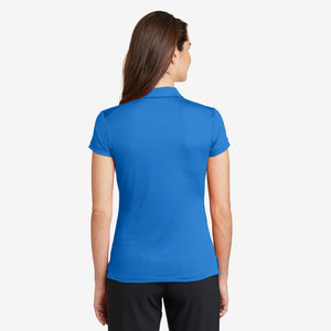 Woman wearing Nike Ladies Dri-FIT Solid Icon Pique Modern Fit Polo in Light Photo Blue Back - 746100