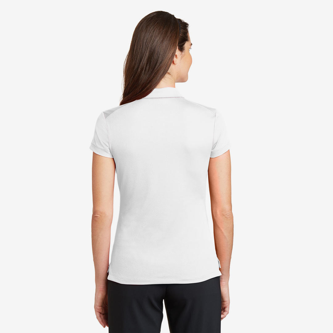 Woman wearing Nike Ladies Dri-FIT Solid Icon Pique Modern Fit Polo in White Back - 746100
