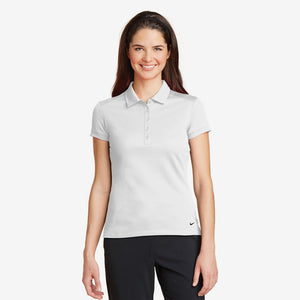 Woman wearing Nike Ladies Dri-FIT Solid Icon Pique Modern Fit Polo in White Front - 746100