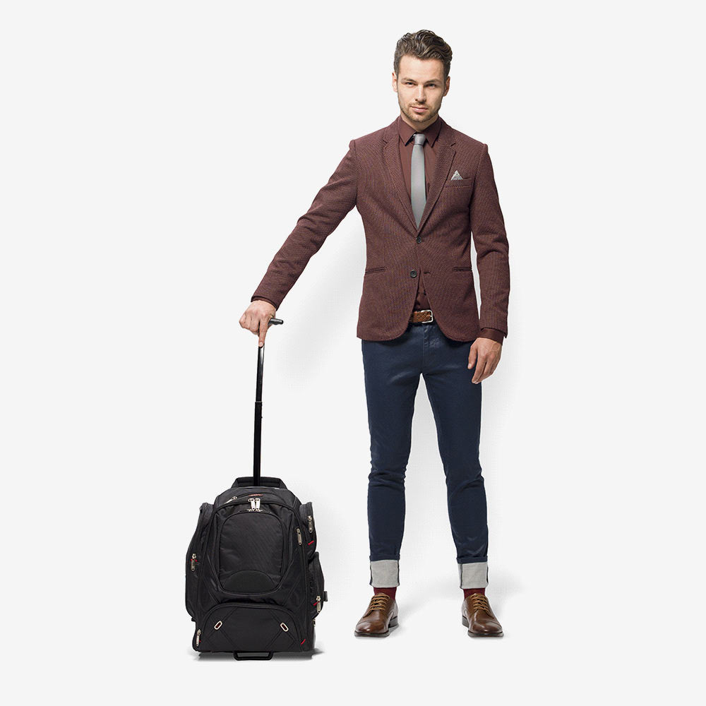 Man travelling with Nottage Elleven Wheeled Compu-Backpack in Black - EL002