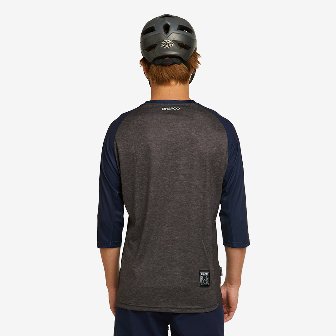 Man wearing DHaRCO Custom Branded Men's 3/4 Sleeve MTB Jersey in Bellstone Back Angle -M34J