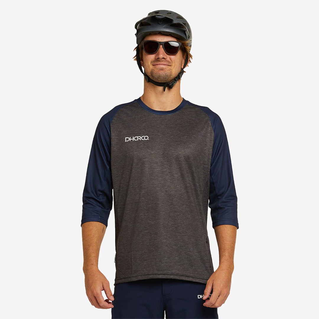 Man wearing DHaRCO Custom Branded Men's 3/4 Sleeve MTB Jersey in Bellstone -M34J