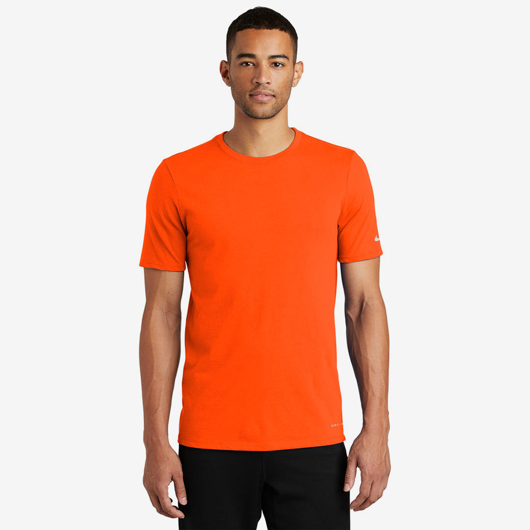 Man wearing Nike Men's Dri-FIT Cotton/Poly Tee in Brilliant Orange Front - NKBQ5231