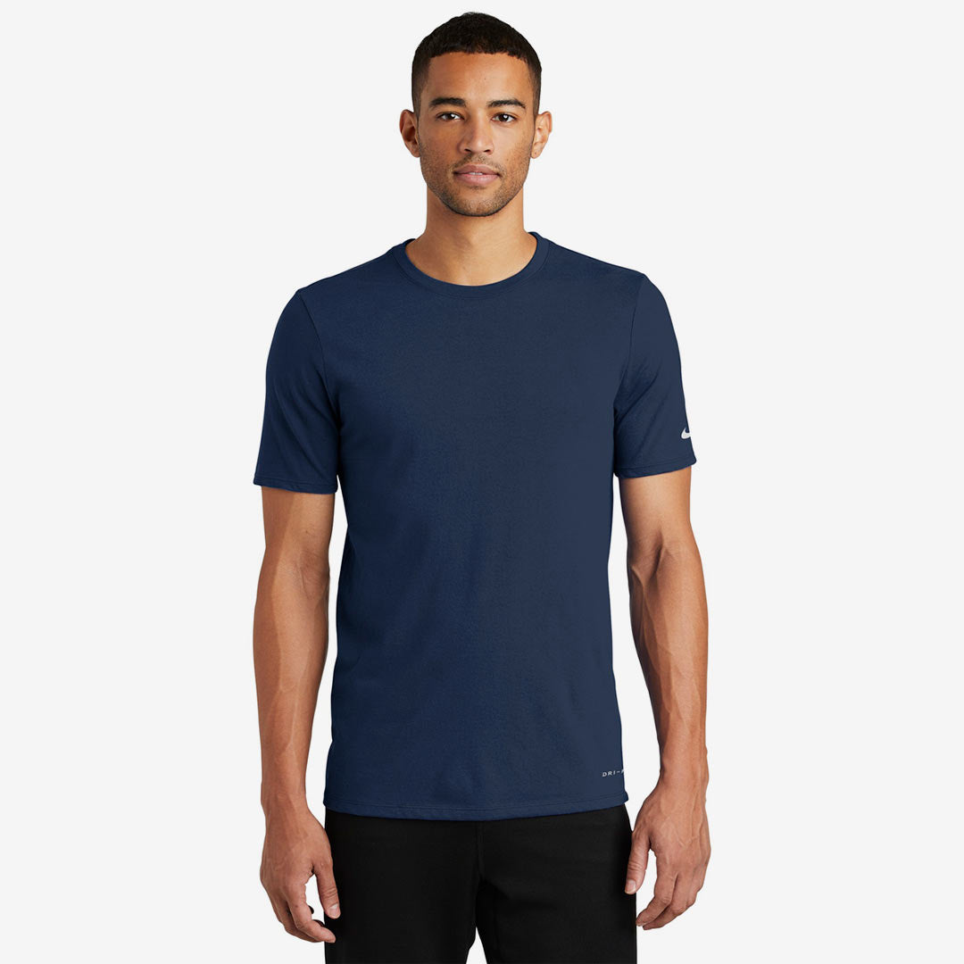Man wearing Nike Men's Dri-FIT Cotton/Poly Tee in College Navy Front - NKBQ5231