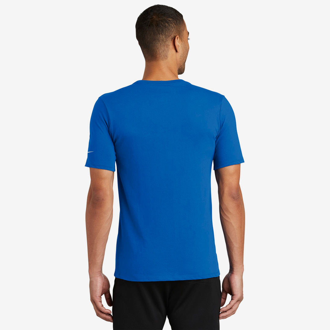 Man wearing Nike Men's Dri-FIT Cotton/Poly Tee in Game Royal Back - NKBQ5231