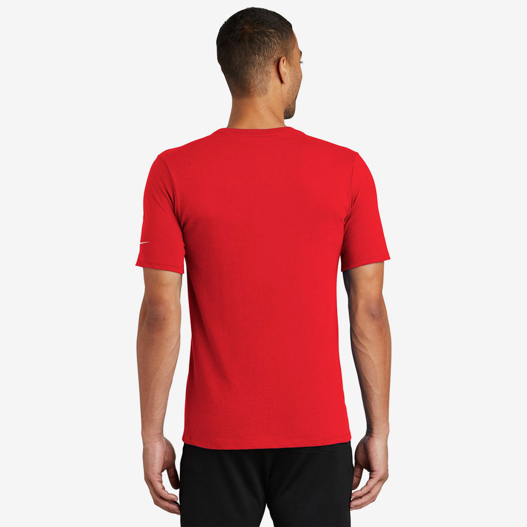Man wearing Nike Men's Dri-FIT Cotton/Poly Tee in University Red Back - NKBQ5231