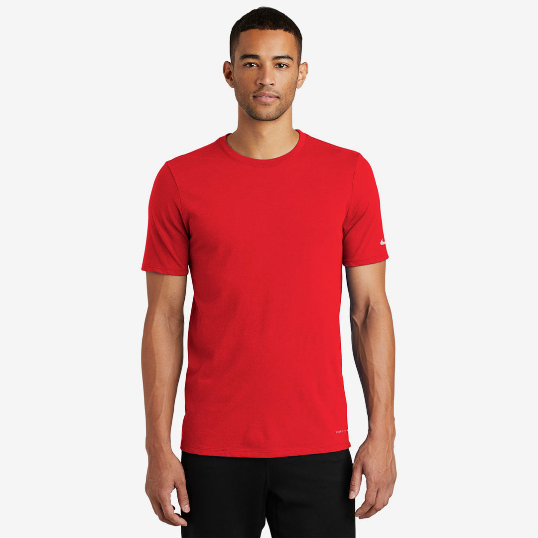 Man wearing Nike Men's Dri-FIT Cotton/Poly Tee in University Red Front - NKBQ5231
