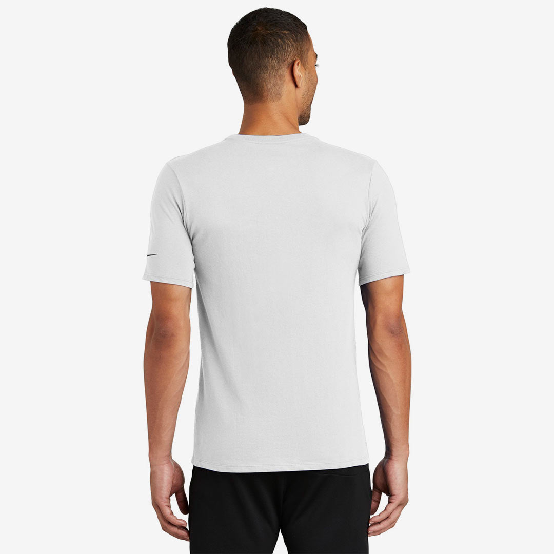 Man wearing Nike Men's Dri-FIT Cotton/Poly Tee in White Back - NKBQ5231