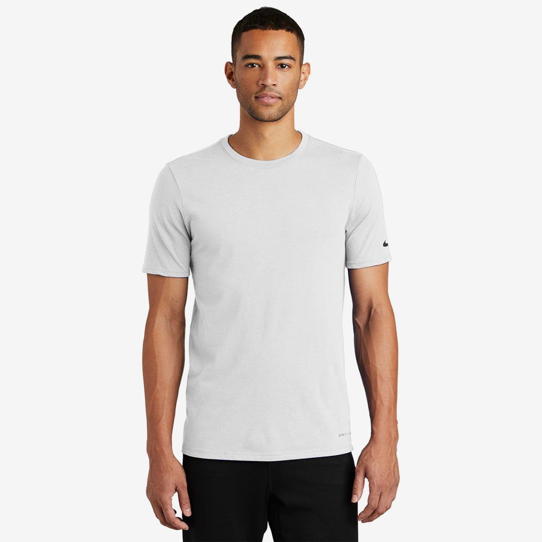 Man wearing Nike Men's Dri-FIT Cotton/Poly Tee in White Front - NKBQ5231