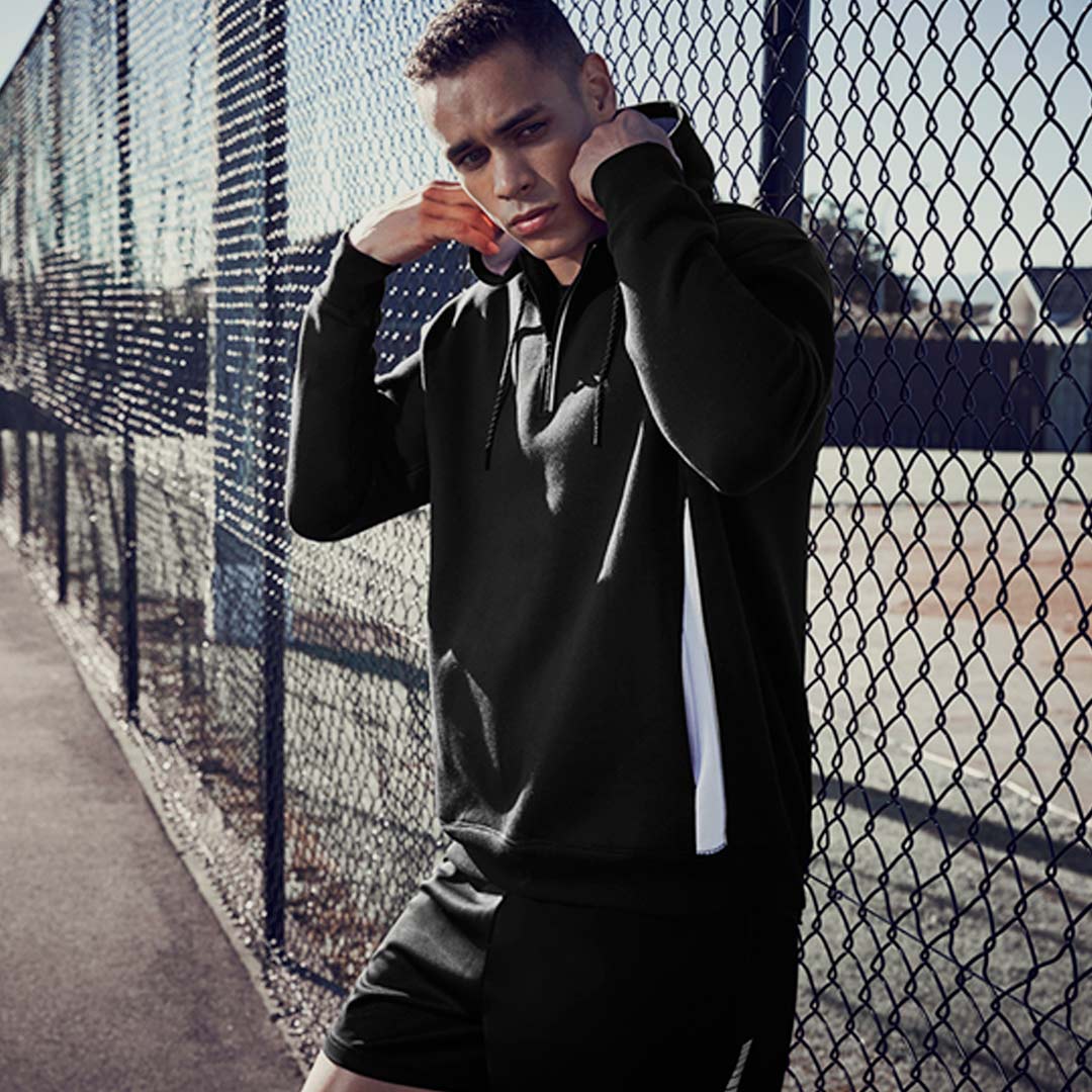 Man wearing Biz Collection Adults Renegade Hoodie in Black - SW710M