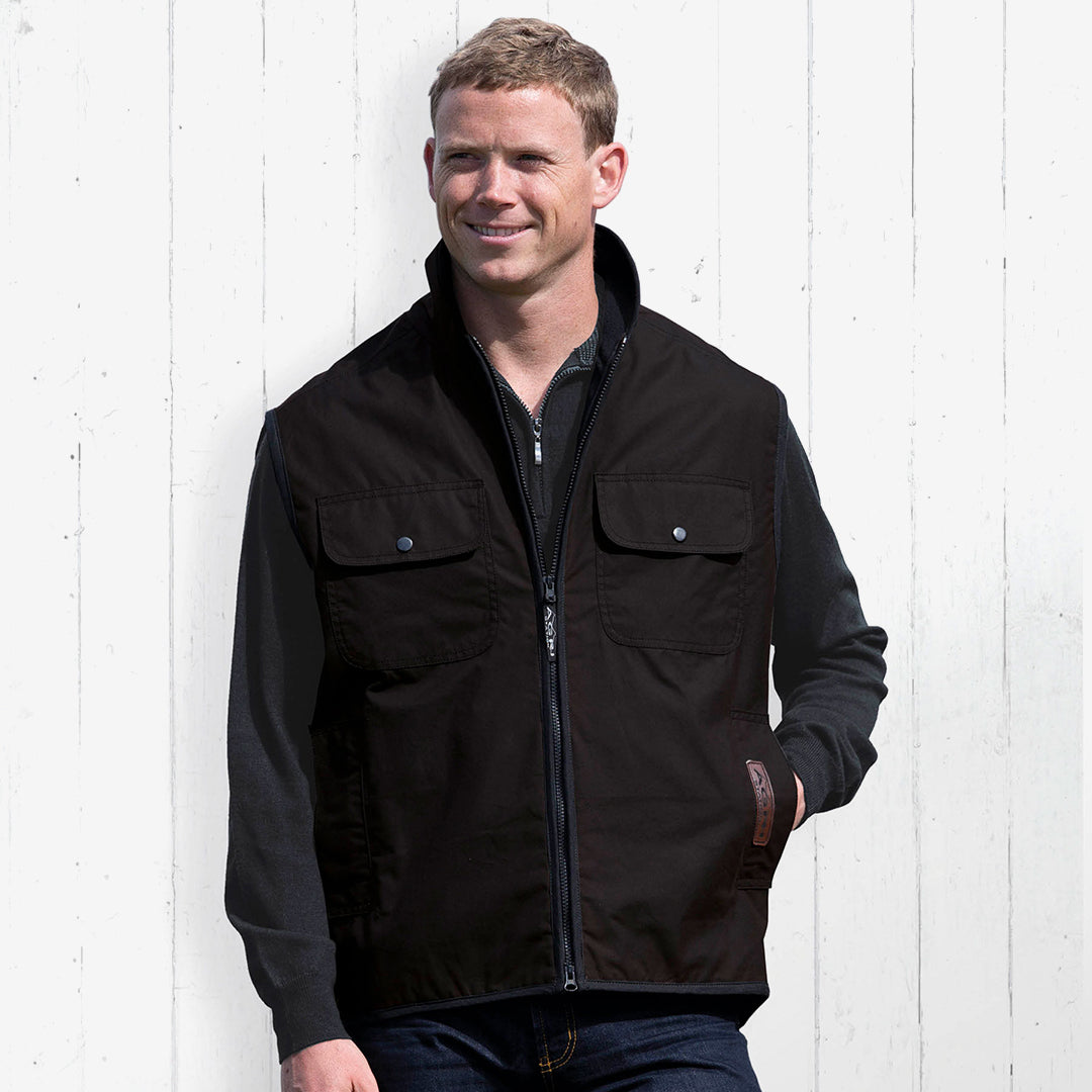 Man wearing Gear for Life Men's Agri Station Ranger Oilskin Vest in Brown - ASROV