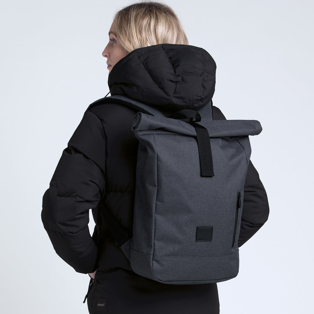 Woman wearing Gear for Life 15L Bounce Roll Top Backpack Grey Melange - SIBRTB